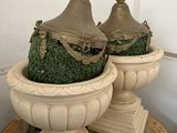 two vases that are sitting on a table