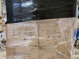 a large stack of boxes sitting on a pallet in a warehouse