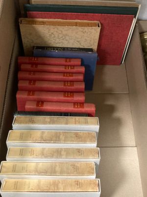 a lot of books in a box on the floor