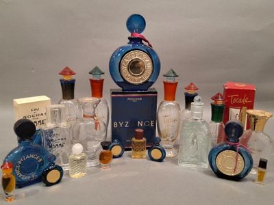 a lot of perfume bottles that are sitting on a table