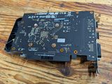 a close up of a computer motherboard on a wooden table