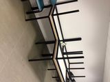 a room with a bed, a desk and a chair
