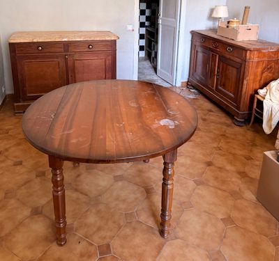 a wooden table in the middle of a living room