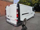 a white van that is parked in a parking lot