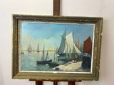 a picture of a painting on a easel next to a wall