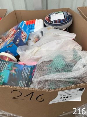 a cardboard box filled with items that are on the floor