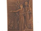 une plaque en bronze représentant une femme et un homme sur une scène