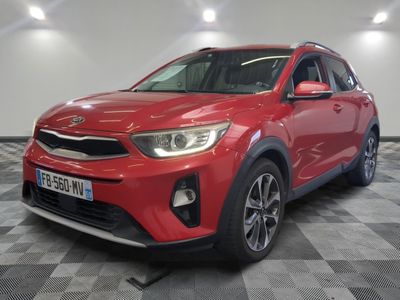 a red suv parked in a room with a checkered floor