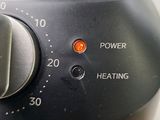 a close up of a black and silver blender