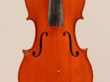an old violin with a bow hanging from it ' s back