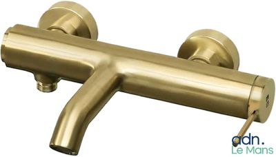 a close up of a brass faucet on a white background