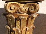 a close up of a decorative column on a wall