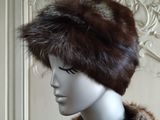 a mannequin head with a fur hat on it