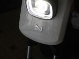 a close up of a motorcycle with a light on it