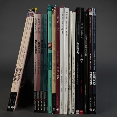 a lot of books that are stacked on top of each other
