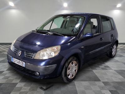 a picture of a blue van parked in a garage