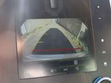 the dashboard of a car with a camera mounted to it ' s side