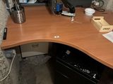 a computer desk with a printer and a printer on it
