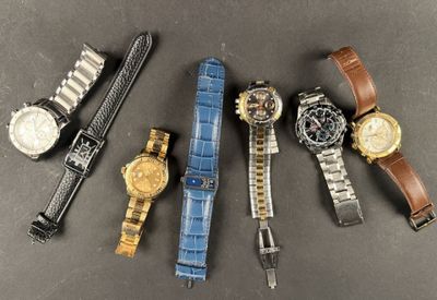 five different types of watches laid out on a table