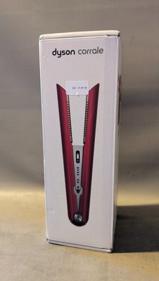 une boîte contenant une brosse à dents électrique rouge et blanche