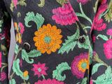 an image of a woman ' s jacket with colorful flowers on it
