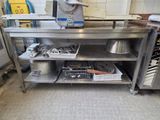 a kitchen with a stove, sink, and dishwasher in it