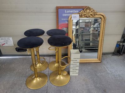 three stools that are sitting in front of a mirror
