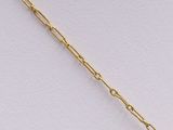 a close up of a gold chain with a heart pendant on it