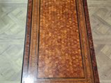 an image of a table with a wooden top on a wooden floor