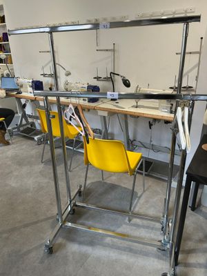 a yellow chair sitting in front of a work station