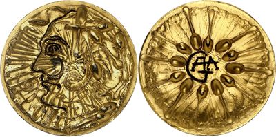 a close up of two gold coins on a white background