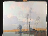 a painting on a easel with a painting of a house in the background