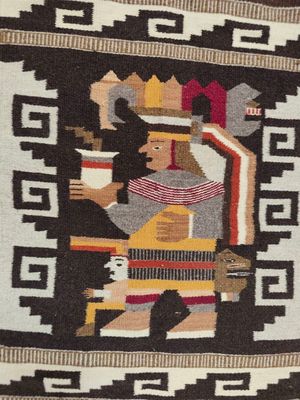 une image représentant un tapis navajo sur lequel figure un homme jouant de la guitare