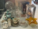 a table with a lot of glass items on it