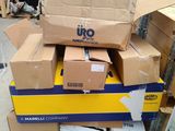 many boxes stacked on top of each other in a warehouse