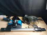 a vacuum that is sitting on a table next to other items