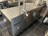 a stainless steel counter top in a commercial kitchen