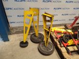 a pile of tools sitting on a pallet in front of a wall