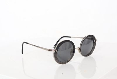 sunglasses on a white surface with a white background