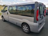 a silver van that is parked in a parking lot