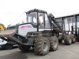 a tractor that is parked in a parking lot next to a car