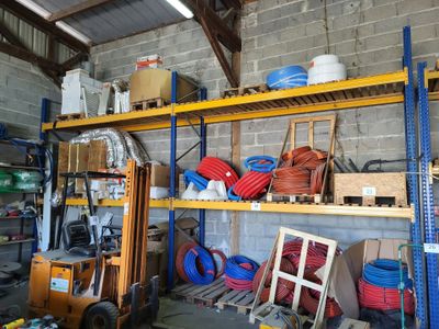 many different types of hoses on the shelves in the garage