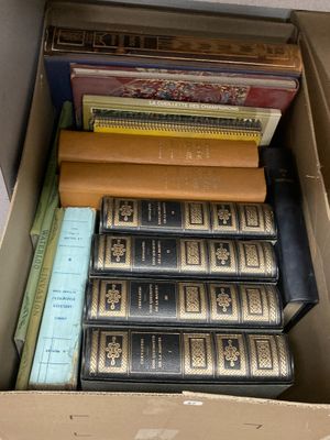 a box full of books sitting on top of a table