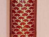 a tall vase that has a pattern on it