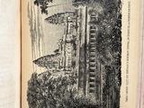 an old book with a picture of a house on it