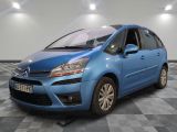 the small blue car is parked in a room with a checkered floor