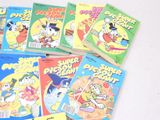 a lot of cartoon books that are on the table