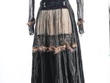 an image of a black and gold dress on a mannequin stand