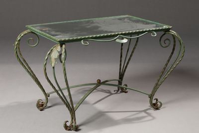 a small table with a glass top on a grey background