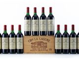 a group of six bottles of wine sitting next to each other